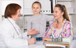© JackF - Little girl and mother with mature medical worker