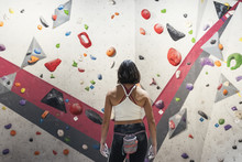 Unrecognizable Woman Ready For Practice Rock Climbing On Artificial Wall Indoors.