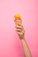  A Woman's Hand Holding A Three-ball Ice Cream