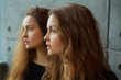 © Alexandr - portrait of two beautiful young girls of twin sisters with flowing hair
