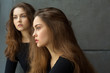 © Alexandr - portrait of two beautiful young girls of twin sisters with flowing hair