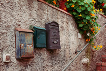 Vintage Iron Rusty Post Boxes On A Wall