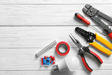 Wall Mural - Different electrical tools on wooden background