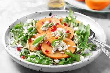 Canvas Print - Tasty persimmon with cottage cheese and arugula on plate