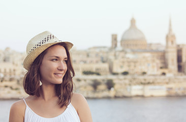 Young woman with hat summer portrait in Valletta, Malta