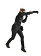 © faestock - full length portrait of female  soldier wearing black  tactical armour with arms raised, isolated on white studio background.