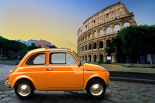 Retro Car On Background Of Colosseum In Rome Italy