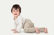 © ASDF - Portrait of a cute sweet baby crawling in the studio