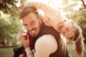 Wall Mural - Father and daughter in park.