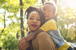 © Mladen - African American family in park.