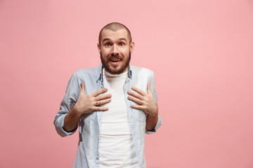 Wall Mural - Let me think. Doubtful pensive man with thoughtful expression making choice against pink background