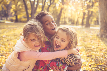 Three little girls in park.