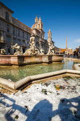 A lovely day of snow in Rome, Italy, 26th February 2018: a beautiful view of Navona Square and Fontana dei Quattro Fiumi (Fountain of Four Rivers) under the snow