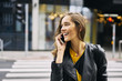 © Westend61 - Woman talking on phone and smiling