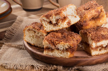Pile Of Cinnamon Swirl Coffee Cake On A Wooden Plate