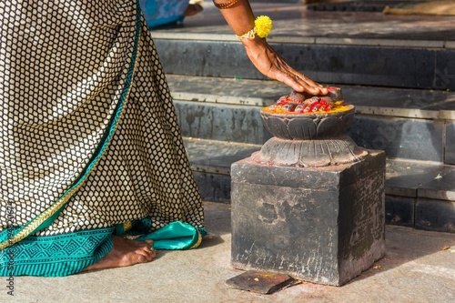 Indian Woman In Traditional Saree Bows The Feet Statue At The Entrance Of Ganesh Temple In Gokulam Mysore India Hinduism Religion Venerate Adore Worship Concept Stock Foto Adobe Stock