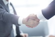 © ASDF - Close up of business handshake in the office