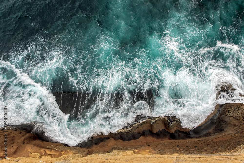 aerial view of ocean waves on cliff  - obrazy, fototapety, plakaty 