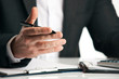 © Gecko Studio - Businessman sitting at the table and explaining something, close-up. Sales Clerk insurer talking trying to convince to client at desk in office over white background