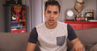 © Mark Adams - Young millennial Hispanic man talking to camera. Video chat with handsome Latino guy on computer screen