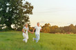 © aletia2011 - senior couple running in field