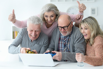 Poster - senior couples playing computer game