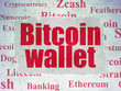 © Maksim Kabakou - Cryptocurrency concept: Painted red text Bitcoin Wallet on Digital Data Paper background with   Tag Cloud