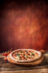 Canvas Print - Pizza. Tasty fresh italian pizza served on old wooden table