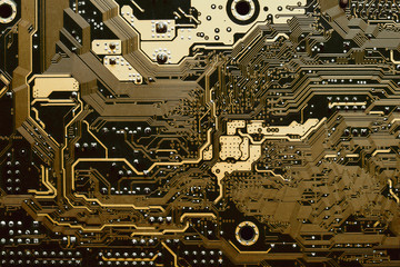 Wall Mural - Close up of a printed golden yellow computer circuit board