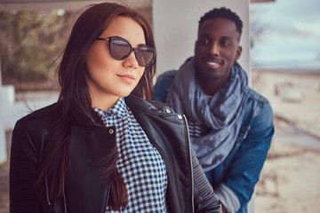 Portrait of an attractive stylish couple. African-American guy w