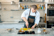 © Volodymyr Shcerbak - chef preparing a polenta in the restaurant kitchen. cooking process