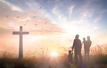 Family Worship God Concept: Silhouette People Looking For The Cross On Autumn Sunrise Background