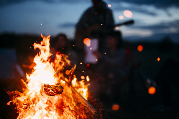 Spark Flying from beach bonfire in summer