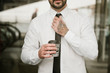 © Antonio Ovejero Diaz/ADDICTIVE STOCK - Crop man adjusting tie