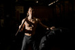© fesenko - Sexy and muscular young man holding a heavy hammer