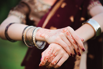 Sticker - Mehndi tattoo. Woman Hands with black henna tattoos. India national traditions
