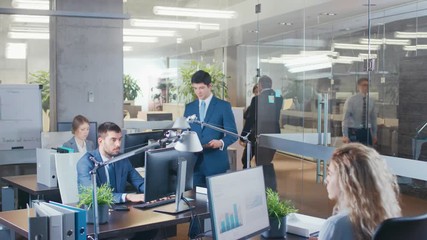 Wall Mural - Elevated Shot of Big Office With Multiple Working Business people Interacting, Sharing Documents, Working with Statistics. Shot on RED EPIC-W 8K Helium Cinema Camera.