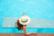 © freebird7977 - Summer Vacations.  Lifestyle woman happy with bikini and big hat relaxing on the swimming pool, travel near the sea and beach in holiday. Summer Concept