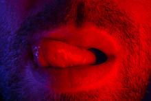 Macro Close Up On Man With Seductive Facial Expression Sticking Out His Tongue Licking His Lips