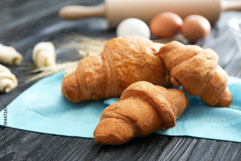 Tasty croissants on table, closeup