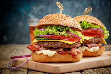 Delicious fresh homemade burger on a wooden table