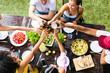 © BONNINSTUDIO/Stocksy - Group of young friends toasting beer's in a summer lunch.