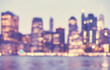 © MaciejBledowski - Blurred vintage toned picture of Manhattan skyline at dusk, abstract urban background, New York City, USA.