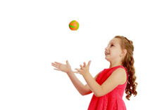 The Little Girl Throws The Ball Up