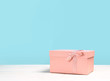 © Katecat - Pink gift box on blue background