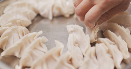 Canvas Print - Making meat dumpling