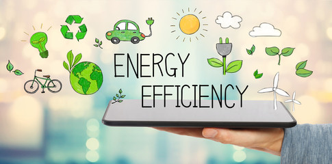 Wall Mural - Energy Efficiency with man holding a tablet computer