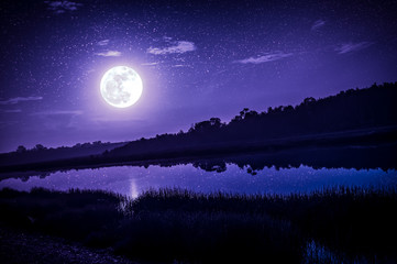 Wall Mural - night sky with full moon and many stars, serenity nature background.