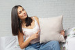 © fotofabrika - Happy smiling woman holding pillow