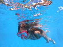 Little Girl Snorkeling In Pool